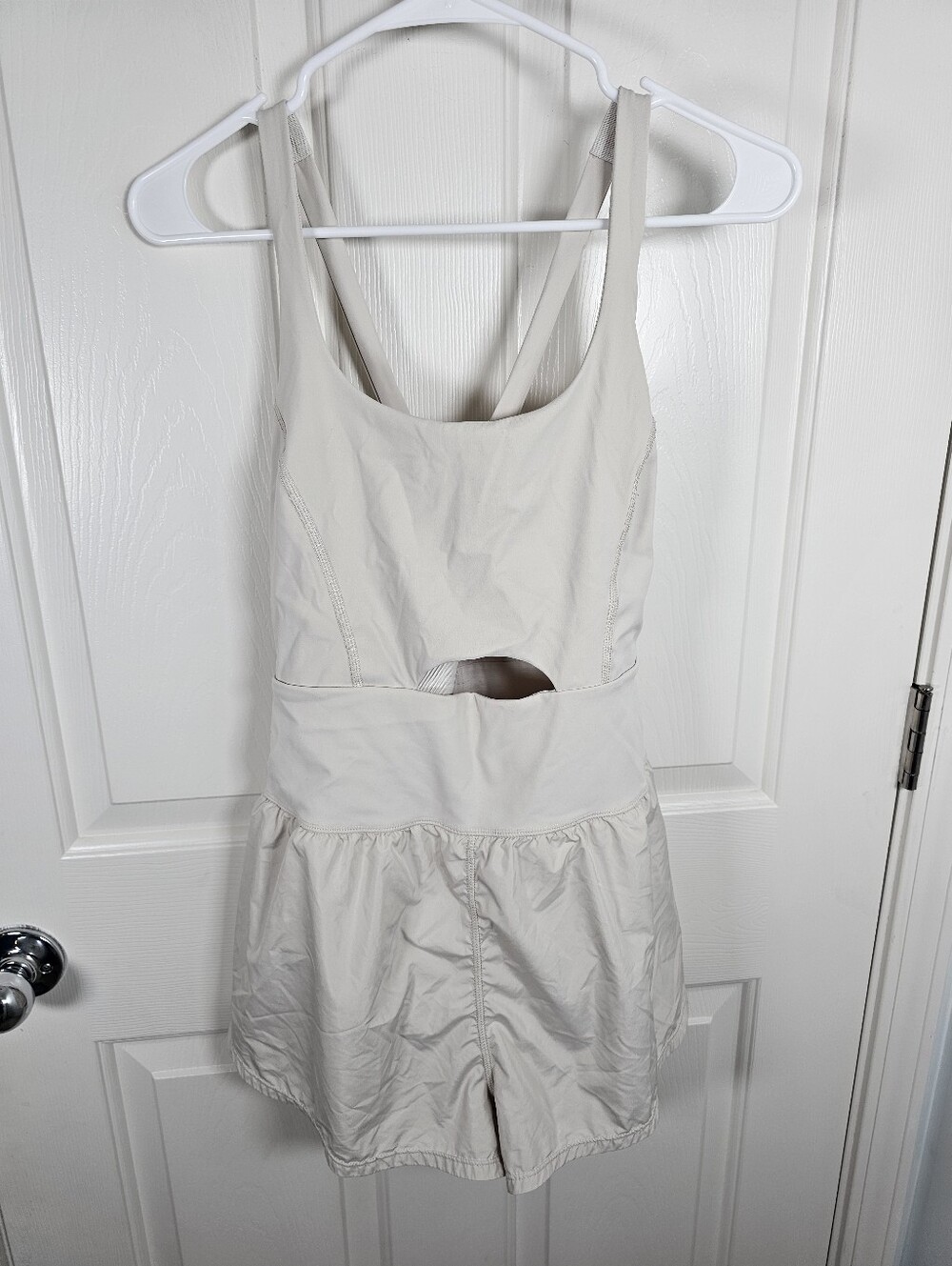 cream-colored Free People FP Movement Righteous Runsie Romper Size M